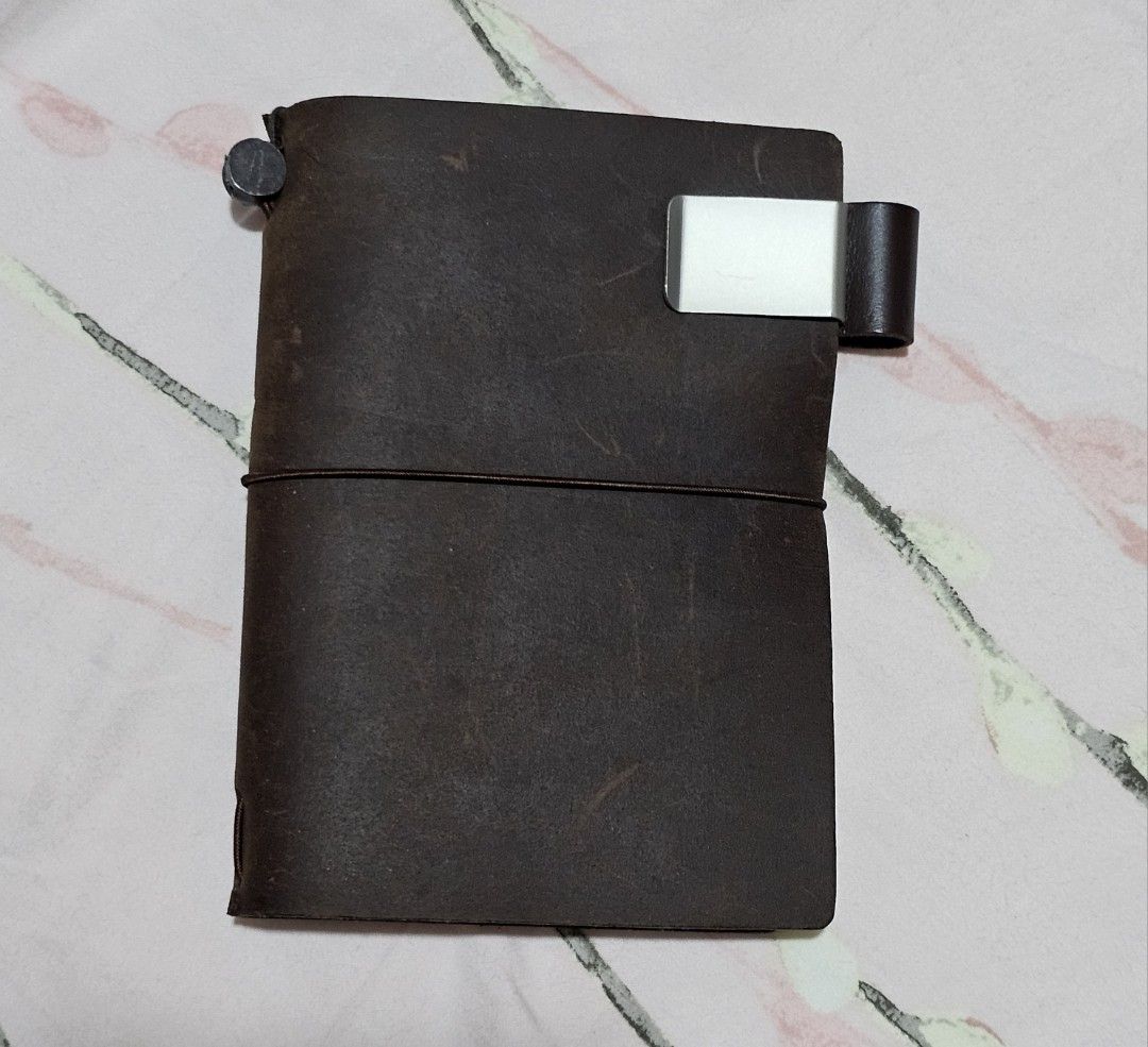 Traveler’s Notebook (Passport size) (Category: Stationery & School Supplies) located in Pasig City. Submitted by kristinesotto (Listing ID 1391076110, Image 1). Description: Letting go of my Traveler’s Notebook (Passport size)! Loved it, but I usually use A5 size. Hardly used — looking for a new home. 😊 Traveler's Notebook Pen Holder is included..