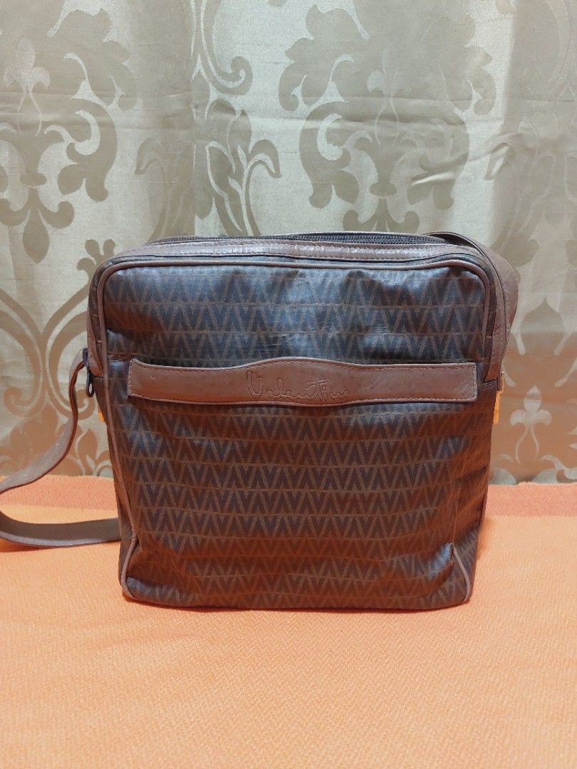 Vintage m.valentino Messenger Bag (Category: Luxury Bags & Wallets) located in Muntinlupa City. Submitted by sakurambo_des (Listing ID 1391077280, Image 1). Description: Vintage Mario Valentino Messenger Bag 2 compartment Issue-light hard leather due to stock,but still in useable.No other flaws follows. Sale 500 only.