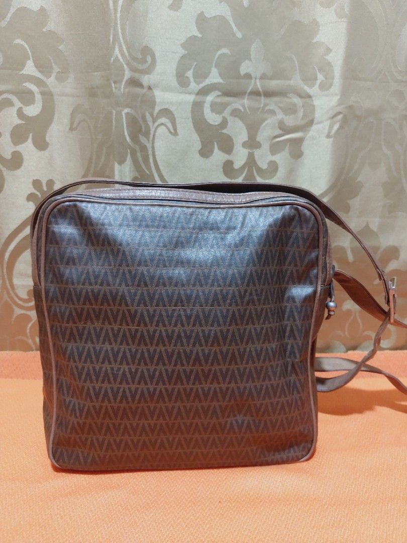 Vintage m.valentino Messenger Bag (Category: Luxury Bags & Wallets) located in Muntinlupa City. Submitted by sakurambo_des (Listing ID 1391077280, Image 2). Description: Vintage Mario Valentino Messenger Bag 2 compartment Issue-light hard leather due to stock,but still in useable.No other flaws follows. Sale 500 only.
