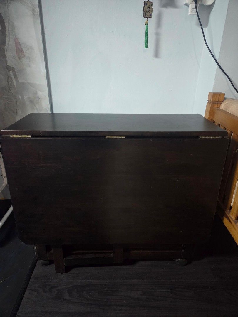 Breakfast Table (Category: Tables & Sets) located in Singapore. Submitted by Sha21_ (Listing ID 1391190846, Image 1). Description: - Dark wood cabinet - Although used, only used for keeping plastic bags. Good condition - Suitable for storage use - 1 drawer slide & 1 open door - No wear and tear present - Rarely used. -Foldable on both side -Original price 500$.