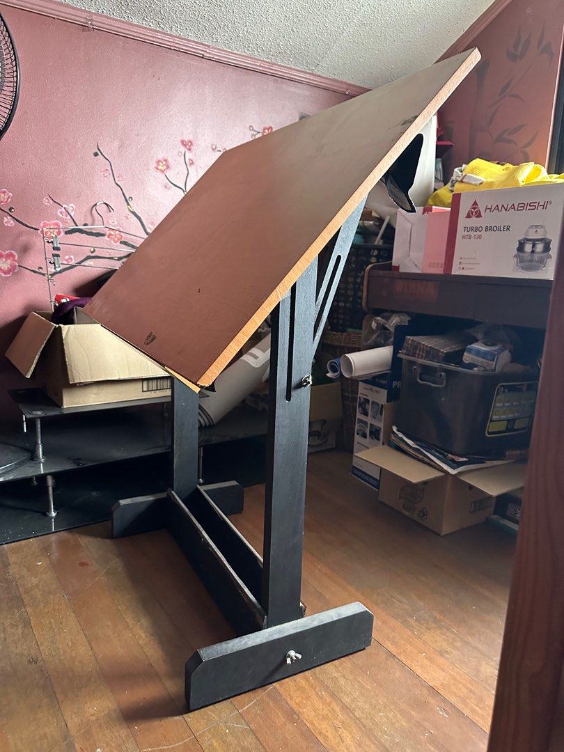 Drafting table : Adjustable Drafting Table (Category: Office Furniture & Fixtures) located in Quezon City. Submitted by leejingco (Listing ID 1388198771, Image 1). Description: Drafting table - adjustable / tilting - for pick up or lalamove / grab (shipping shouldered by buyer) - signs of usage refer to photos for condition Will clean before pick up/shipping 😃.