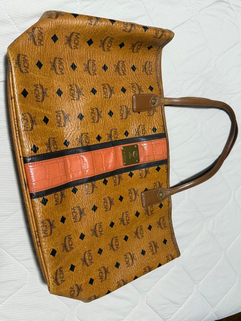 Limited Edition MCM Tote Bag (Category: Luxury Bags & Wallets) located in Pasig City. Submitted by summerda (Listing ID 1391269803, Image 1). Description: Authentic Original MCM Aren Tote Bag. It’s the Neverfull of MCM. In good condition but well used thus the price, for expectation setting. Very good travel, pangaharabas or even school/office bag RFS: Not being used Original Price: 55k Selling Price: 5.5k (negotiable).