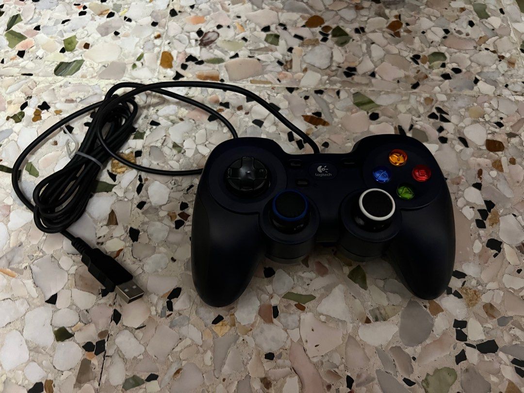 Logitech Gamepad Controller (Category: Controllers) located in Singapore. Submitted by 1y2i3j (Listing ID 1391209466, Image 1). Description: - Logitech USB gamepad controller - In good working condition - Responsive buttons and joysticks - Perfect for PC gaming - Includes original cable.