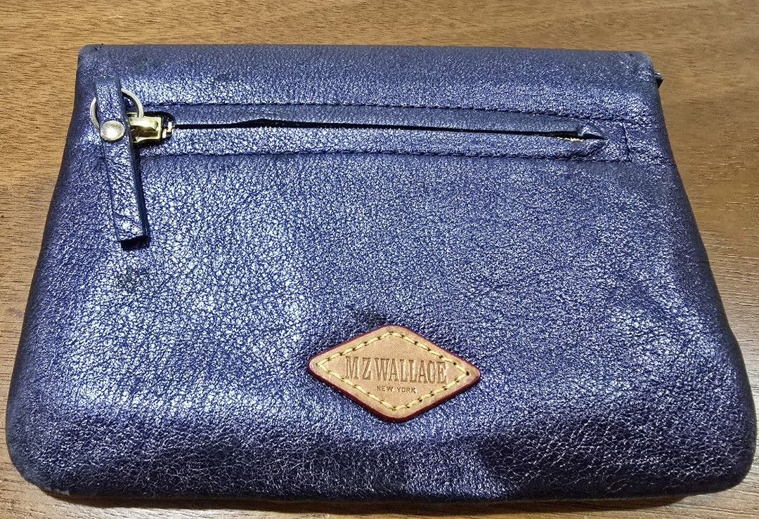 MZ WALLACE New York wallet (Category: Wallets & Card holders) located in Manila. Submitted by misstoomanythings (Listing ID 1391213545, Image 2). Description: Navy blue leather wallet from MZ Wallace New York Inside and outside zipped compartment With 2 additional sections for your cash & receipts Wallet is in great condition with signs of natural patina.