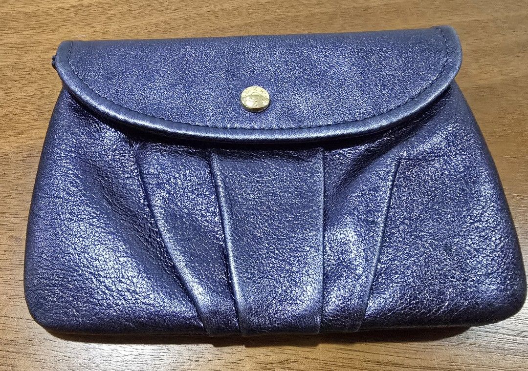 MZ WALLACE New York wallet (Category: Wallets & Card holders) located in Manila. Submitted by misstoomanythings (Listing ID 1391213545, Image 1). Description: Navy blue leather wallet from MZ Wallace New York Inside and outside zipped compartment With 2 additional sections for your cash & receipts Wallet is in great condition with signs of natural patina.