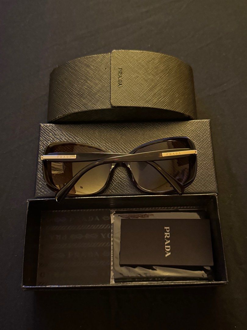 Prada Shades (Category: Sunglasses & Eyewear) located in Paranaque City. Submitted by preloveditems111 (Listing ID 1391340489, Image 2). Description: Brand new Never worn Bought before but never used.