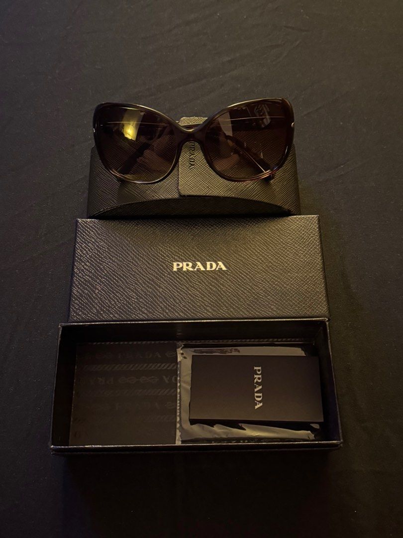 Prada Shades (Category: Sunglasses & Eyewear) located in Paranaque City. Submitted by preloveditems111 (Listing ID 1391340489, Image 1). Description: Brand new Never worn Bought before but never used.