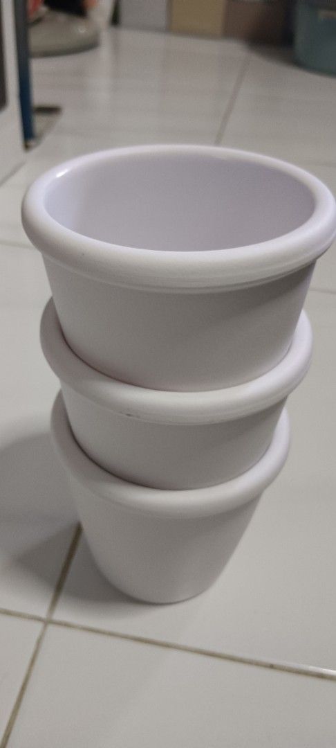 White Stackable Pots (Category: Pots & Planters) located in Singapore. Submitted by angela92386236 (Listing ID 1391326385, Image 1). Description: - Set of three stackable white pots - Perfect for small plants or storage - Clean and in good condition - Suitable for indoor or outdoor use.