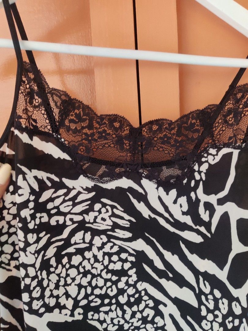 Animal print dress/top (Category: Sleeveless) located in Apalit. Submitted by daintynyla (Listing ID 1391399127, Image 3). Description: - Can be worn as a top or dress underneath your stockings. - light fabric - comfy to wear.