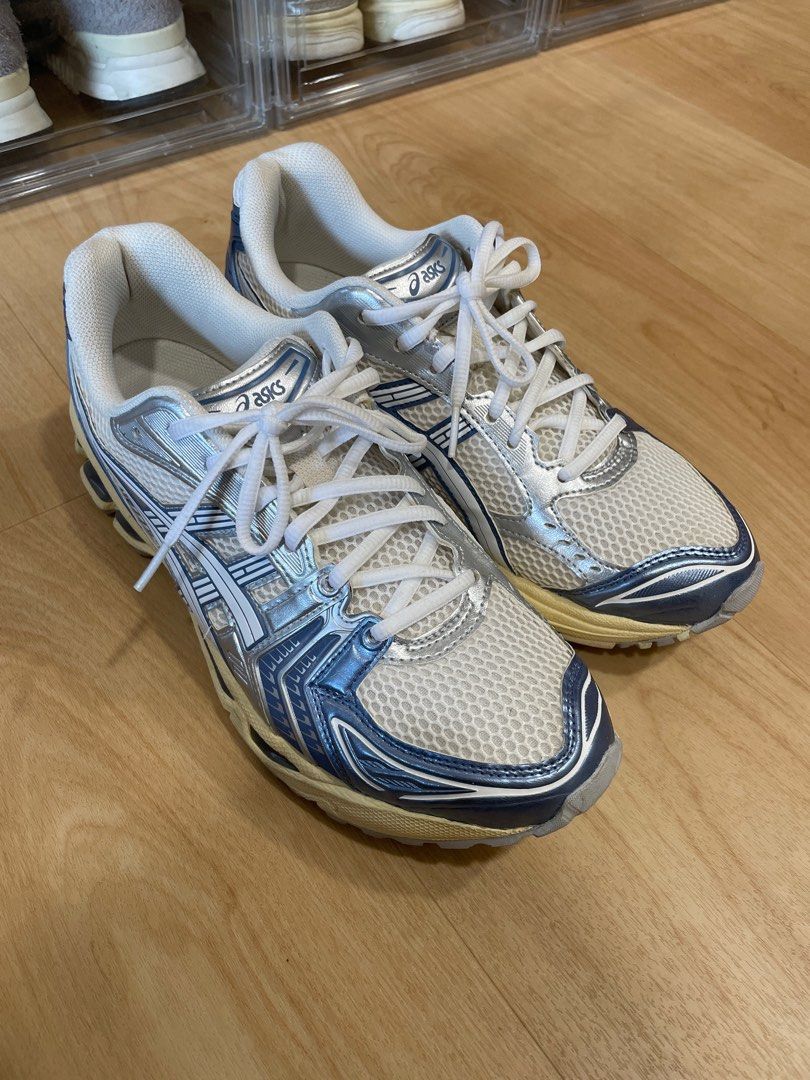 Asics Gel-Kayano 14 - White/Silver/Blue (Category: Sneakers) located in Singapore. Submitted by sgnumberoneeee (Listing ID 1391436023, Image 2). Description: - Used Asics Gel-Kayano 14 running shoes - Color: White, Silver, Blue - Condition: Good, with some wear on soles and uppers - Plenty of life remaining.