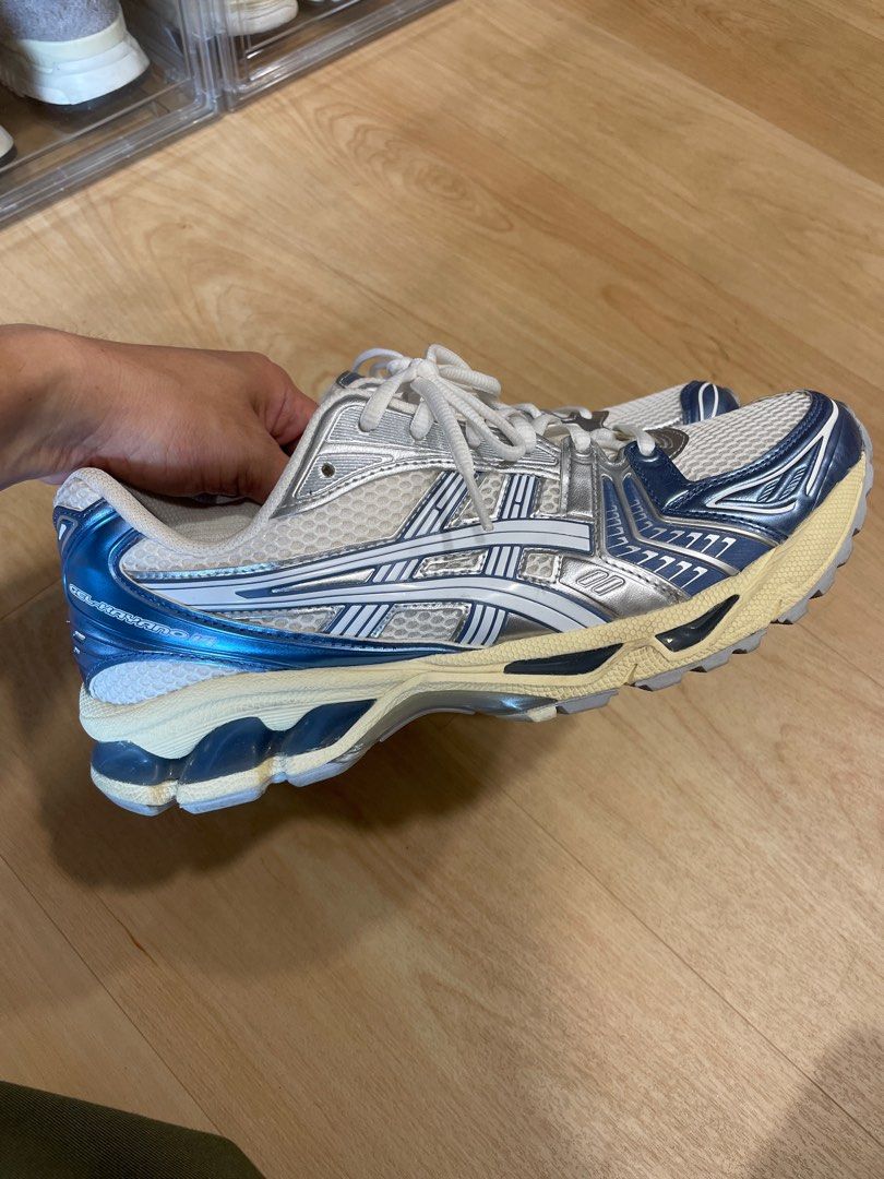 Asics Gel-Kayano 14 - White/Silver/Blue (Category: Sneakers) located in Singapore. Submitted by sgnumberoneeee (Listing ID 1391436023, Image 1). Description: - Used Asics Gel-Kayano 14 running shoes - Color: White, Silver, Blue - Condition: Good, with some wear on soles and uppers - Plenty of life remaining.
