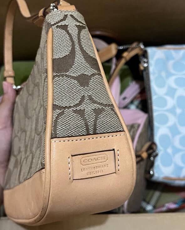 Coach demi pochette (Category: Luxury Bags & Wallets) located in Bulacan. Submitted by lily.marie (Listing ID 1391417930, Image 2). Description: Coach demi Pochette - brown • With dust bag • light watermarks •no issue/flaws • so so so pretty • with free purse chain extender ✨ Slightly negotiable, drop your offers.