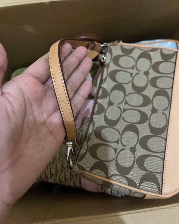 Coach demi pochette (Category: Luxury Bags & Wallets) located in Bulacan. Submitted by lily.marie (Listing ID 1391417930, Image 3). Description: Coach demi Pochette - brown • With dust bag • light watermarks •no issue/flaws • so so so pretty • with free purse chain extender ✨ Slightly negotiable, drop your offers.