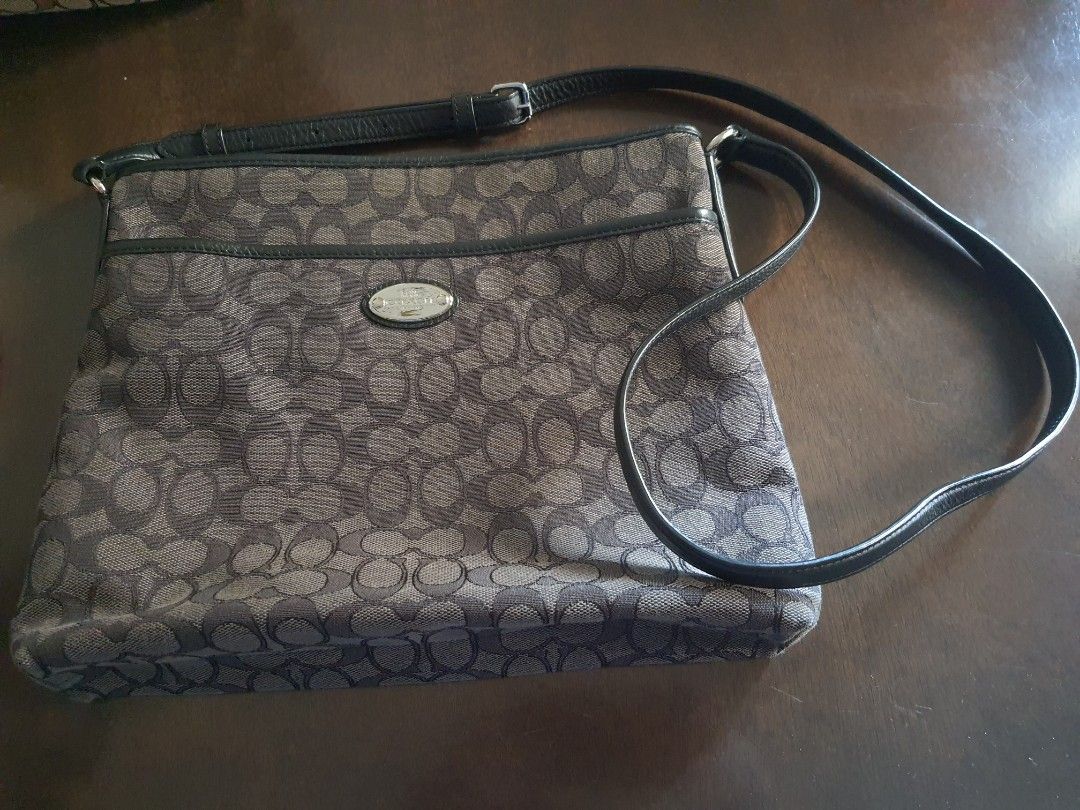 Coach outline signature canvas (Category: Luxury Bags & Wallets) located in Malolos. Submitted by aonf1 (Listing ID 1391407760, Image 1). Description: 100% authentic black and gray inside zip, cell and multifunction pockets center zip compartment 11" drop handle gucci prada Louis Vuitton bottega venetto cln dior fossil hermes.
