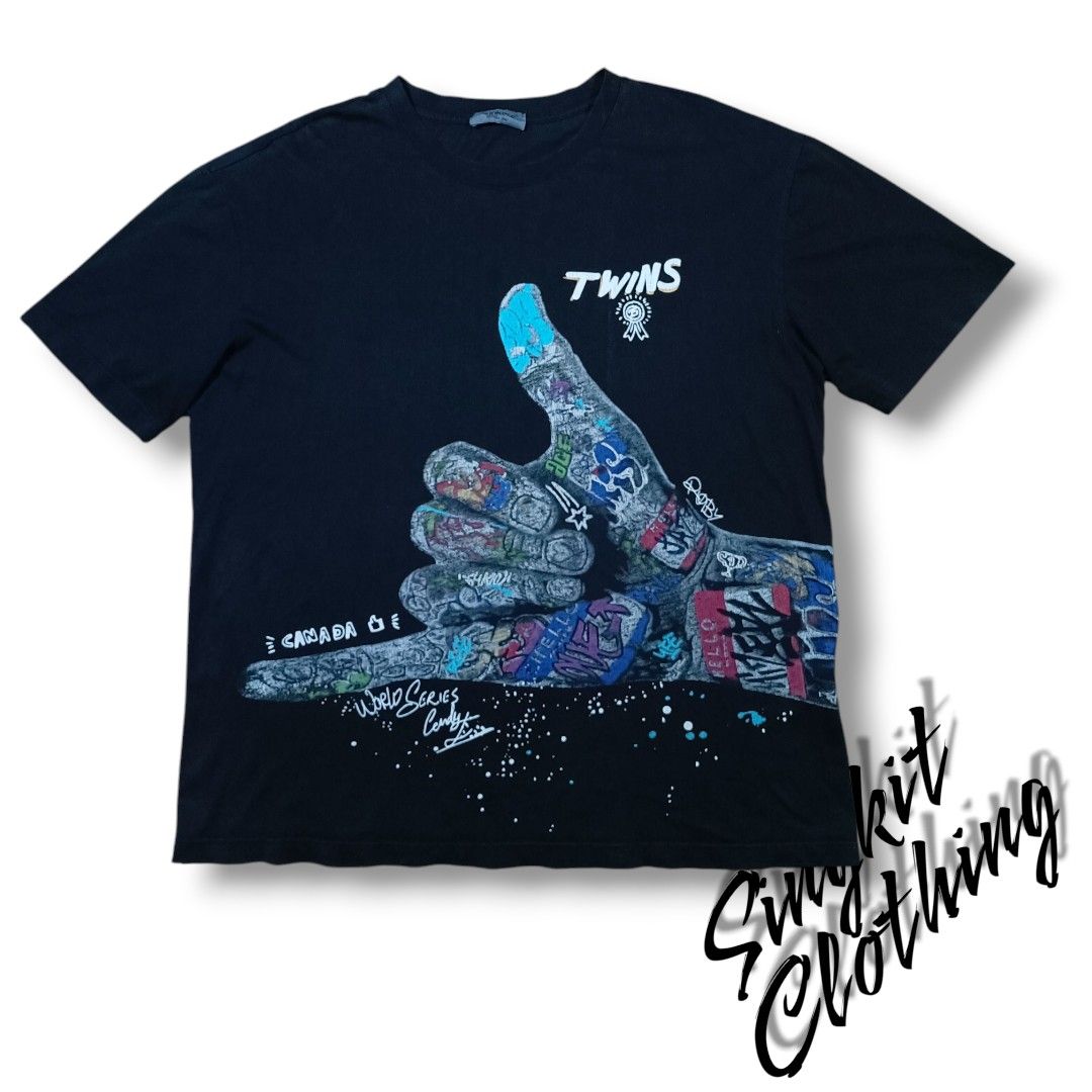 Graphic shaka sign cool print (Category: Tshirts & Polo Shirts ) located in Quezon City. Submitted by selectorsthrift (Listing ID 1391501462, Image 1). Description: in good condition issue shown on photos loose stitch, sun fade. size large 22x27.