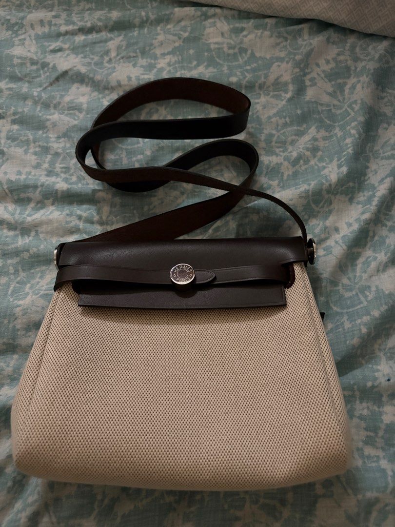 Hermes Mini Her Bag Leather Canvas Palladium Hardware (Category: Luxury Bags & Wallets) located in Taguig. Submitted by gigie24 (Listing ID 1391500119, Image 1). Description: Mini Herbag Leather Canvas Palladium Hardware - Pre love from Japan with Dust Bag only cannot guarantee authenticity Measurements: 8" width x 6.5" height x 2.5" depth; 18" shoulder strap drop Hermès Herbag Zip 20 Mini Ecru and Beige Toile H canvas and Ebene Vache Hunter with