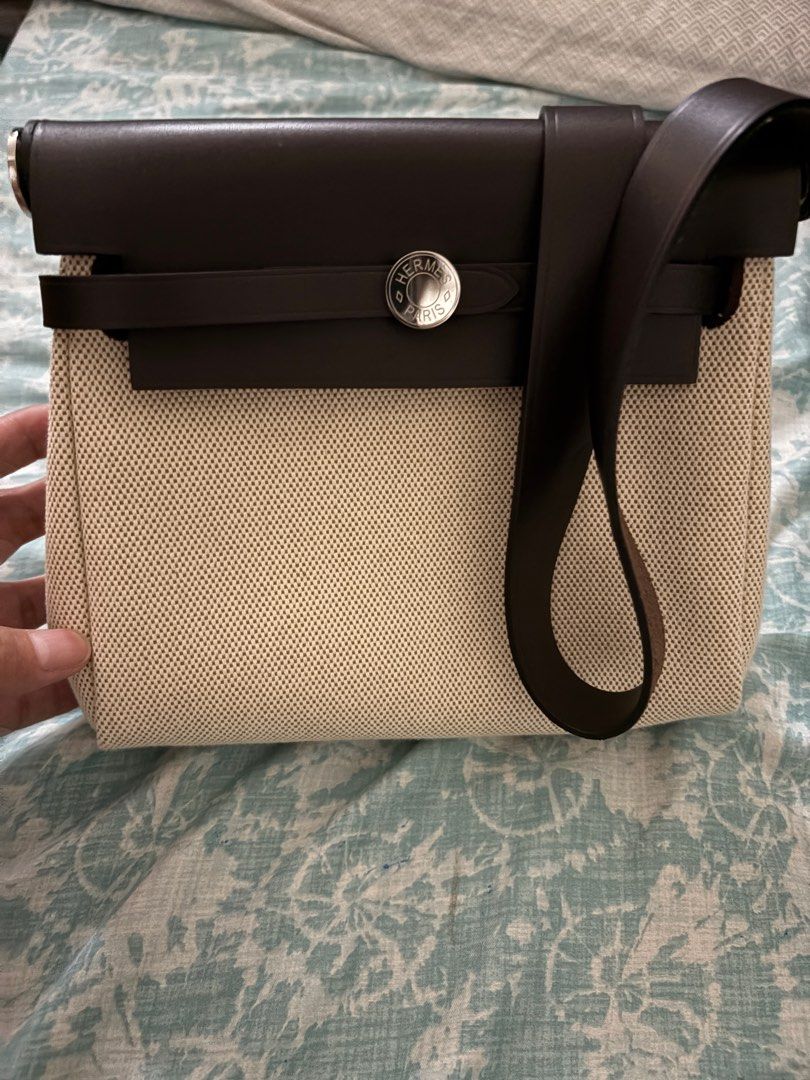 Hermes Mini Her Bag Leather Canvas Palladium Hardware (Category: Luxury Bags & Wallets) located in Taguig. Submitted by gigie24 (Listing ID 1391500119, Image 2). Description: Mini Herbag Leather Canvas Palladium Hardware - Pre love from Japan with Dust Bag only cannot guarantee authenticity Measurements: 8" width x 6.5" height x 2.5" depth; 18" shoulder strap drop Hermès Herbag Zip 20 Mini Ecru and Beige Toile H canvas and Ebene Vache Hunter with