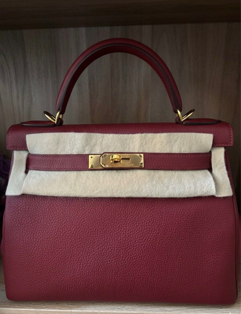 Kelly 28 Rouge Grenat (Category: Luxury Bags & Wallets) located in Taguig. Submitted by timelesstotesph (Listing ID 1391424226, Image 1). Description: Kelly 28 Rouge Grenat Ghw Stamp X With box, dustbag, care booklet, strap Meetups available .