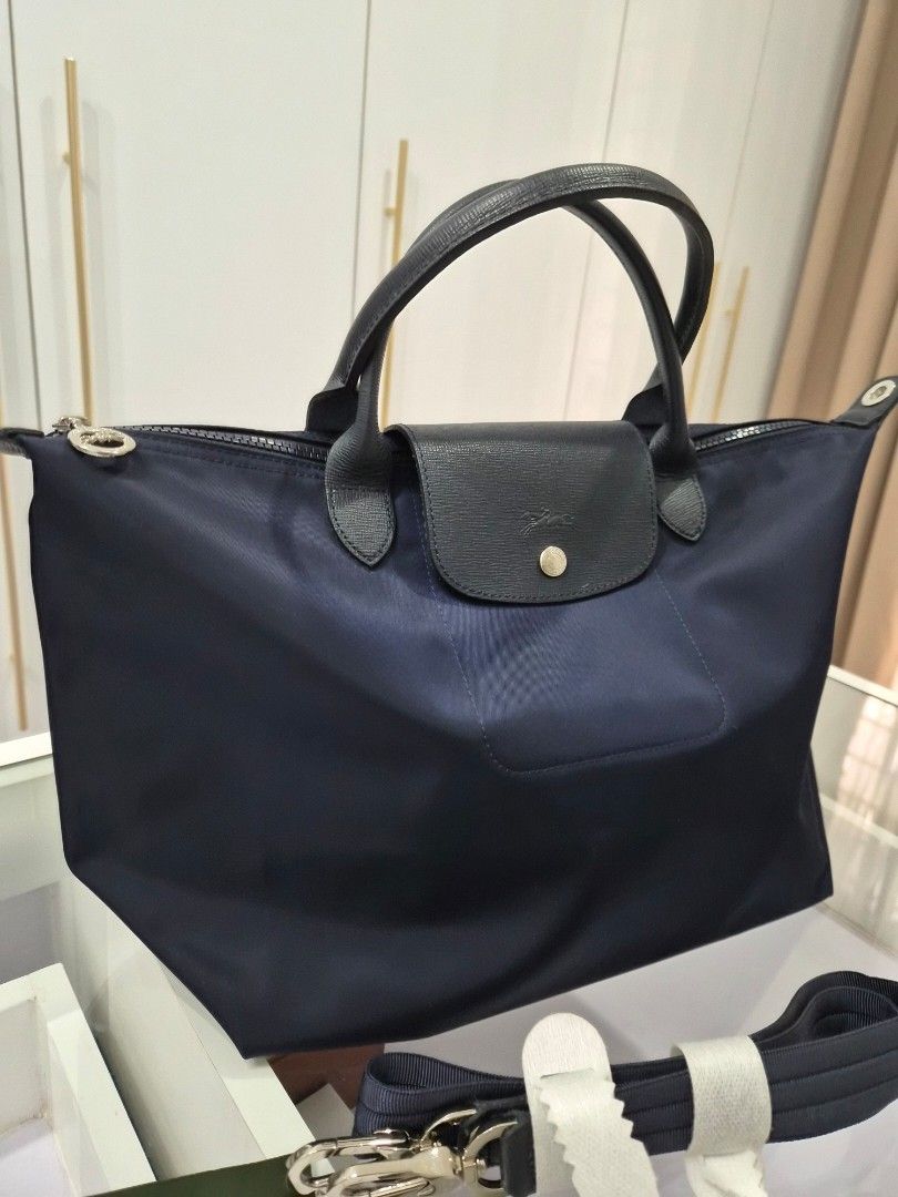 Longchamp Neo (Category: Luxury Bags & Wallets) located in Mandaluyong City. Submitted by seafoamint (Listing ID 1391478271, Image 2). Description: authentic with crossbody strap size medium color navy.