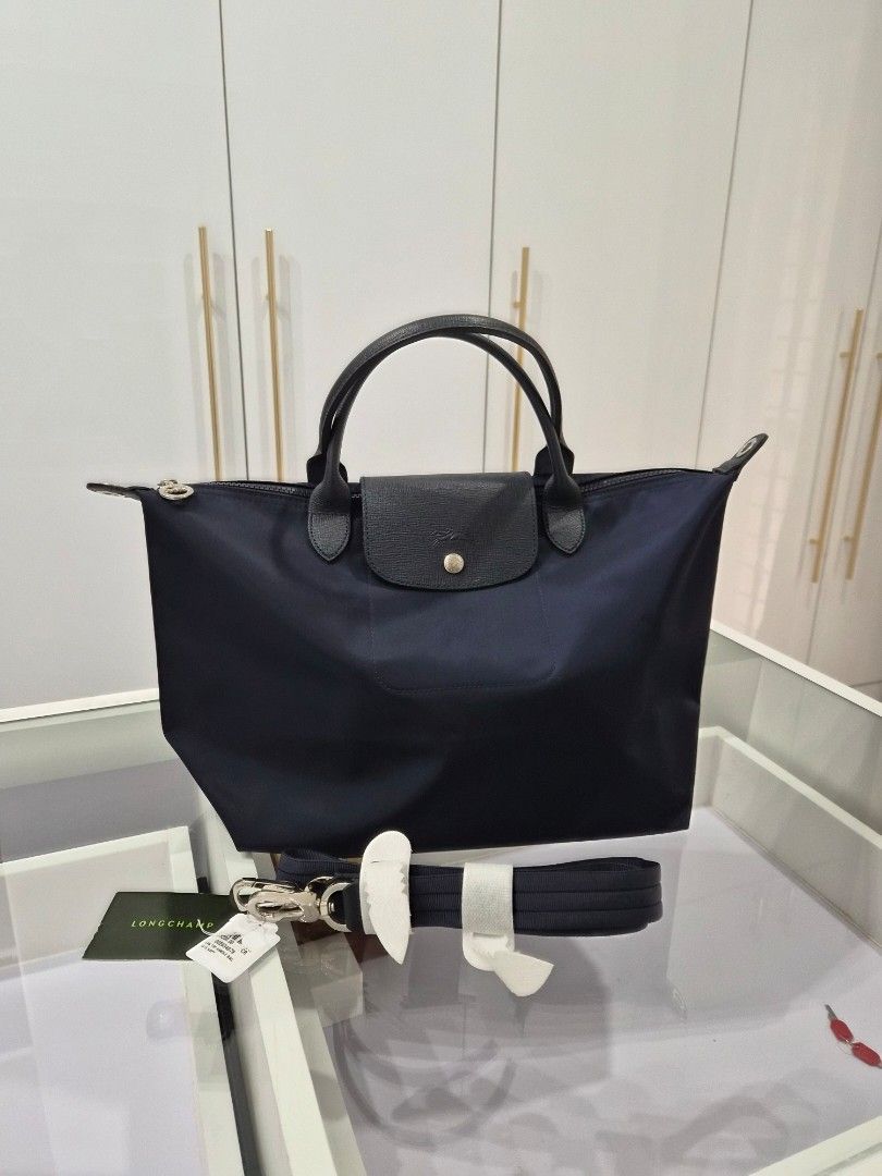 Longchamp Neo (Category: Luxury Bags & Wallets) located in Mandaluyong City. Submitted by seafoamint (Listing ID 1391478271, Image 1). Description: authentic with crossbody strap size medium color navy.