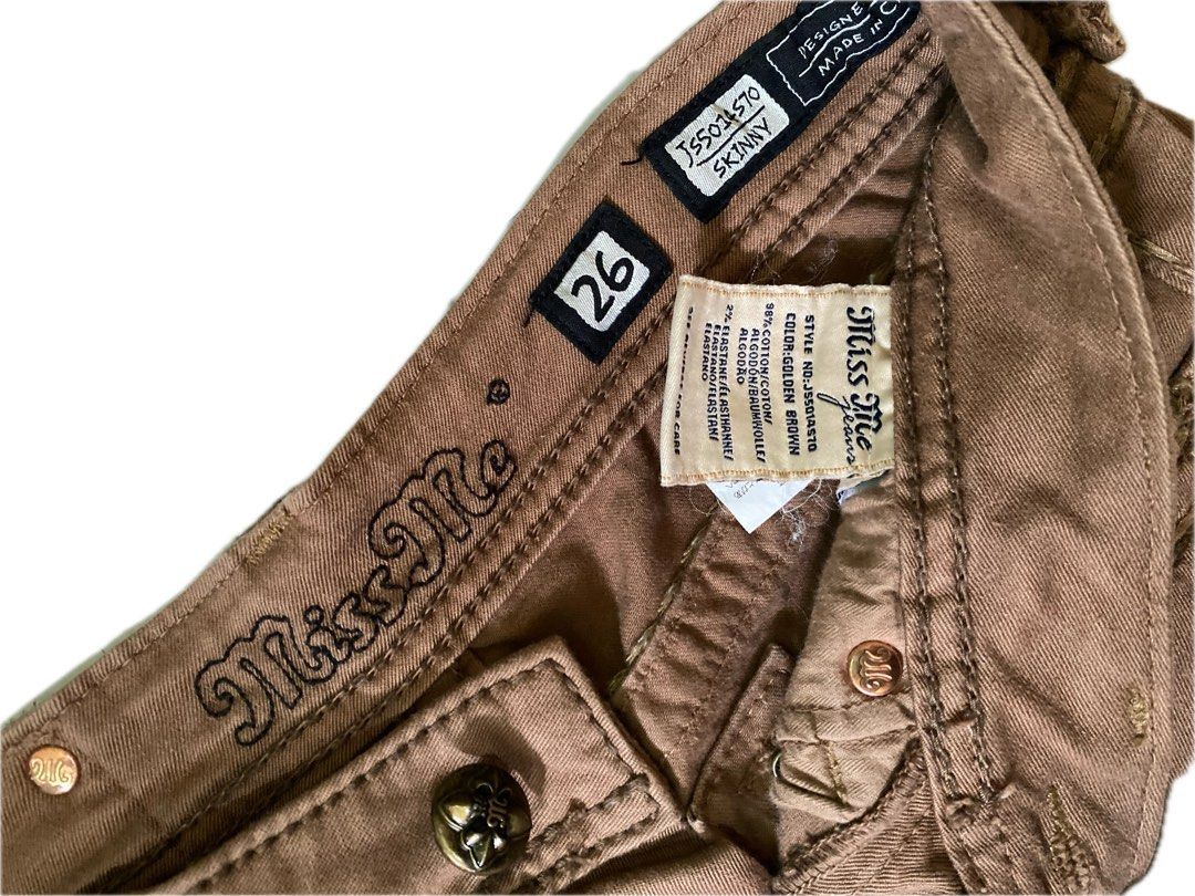 Miss Me Jeans (Category: Jeans) located in Mangaldan. Submitted by avaph (Listing ID 1391359021, Image 3). Description: Miss Me Skinny Jeans – Size 26 (Brown) with Embellished Pockets Condition: Excellent Price: ₱600 Elevate your denim game with these chic Miss Me skinny jeans, size 26, in a warm brown hue. Crafted with a comfy cotton-elastane blend (98% cotton, 2% elastane), these jeans feature signature embellished flap back pockets, stylish de