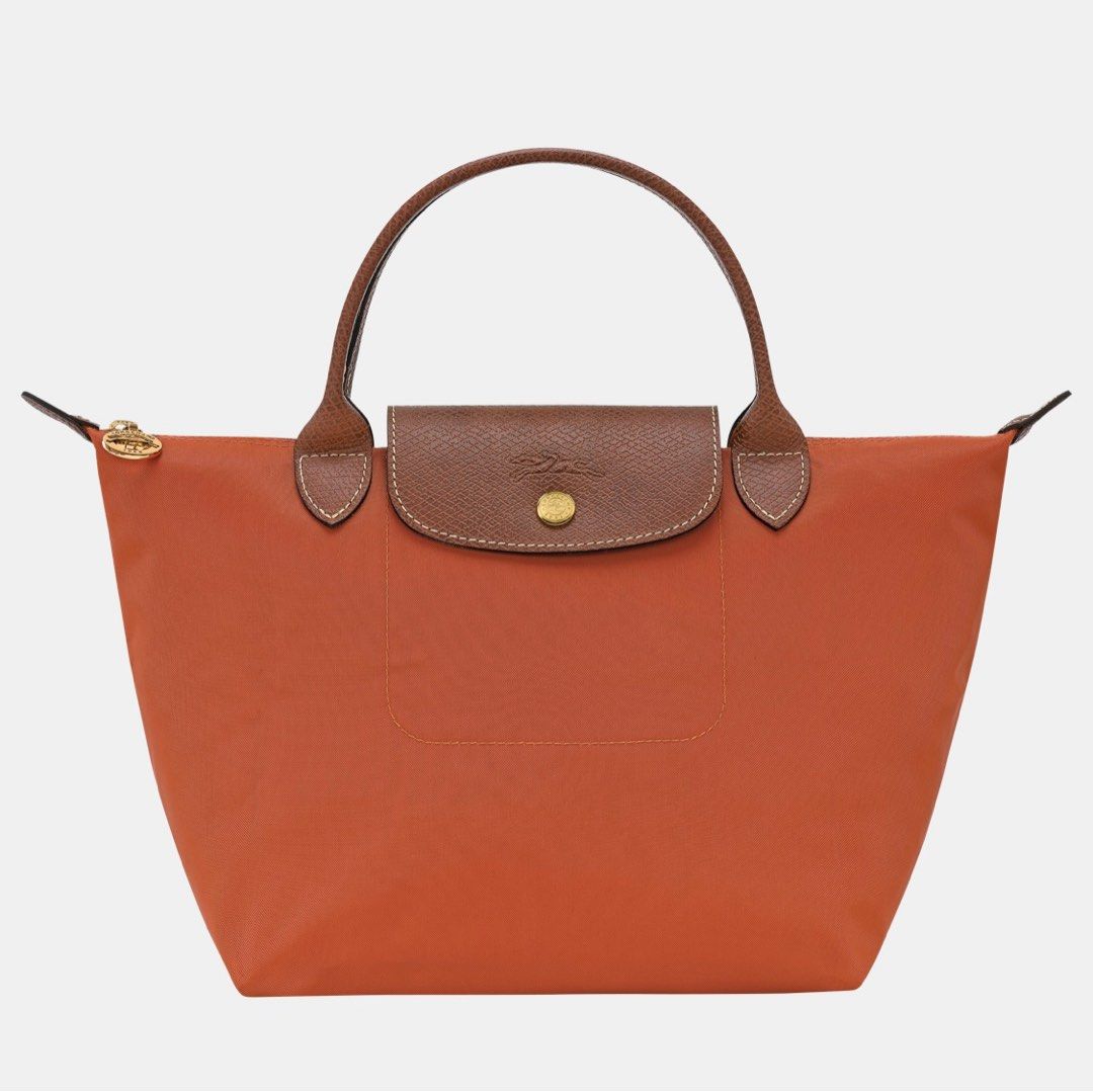 PRELOVED - LE PLIAGE ORIGINAL Small HANDBAG - Orange (Category: Tote Bags) located in Naga. Submitted by Rveebee (Listing ID 1391400857, Image 1). Description: PRELOVED - LE PLIAGE ORIGINAL Small HANDBAG - Orange Original price - ₱ 9,000.00 Store - Longchamp Rustan’s Shangri-La Plaza Size - Small Top handle Color - Orange RFS - just recently bought a new one of different color Condition - Bought on January 13, 2024, after 2 days - January 15th, I