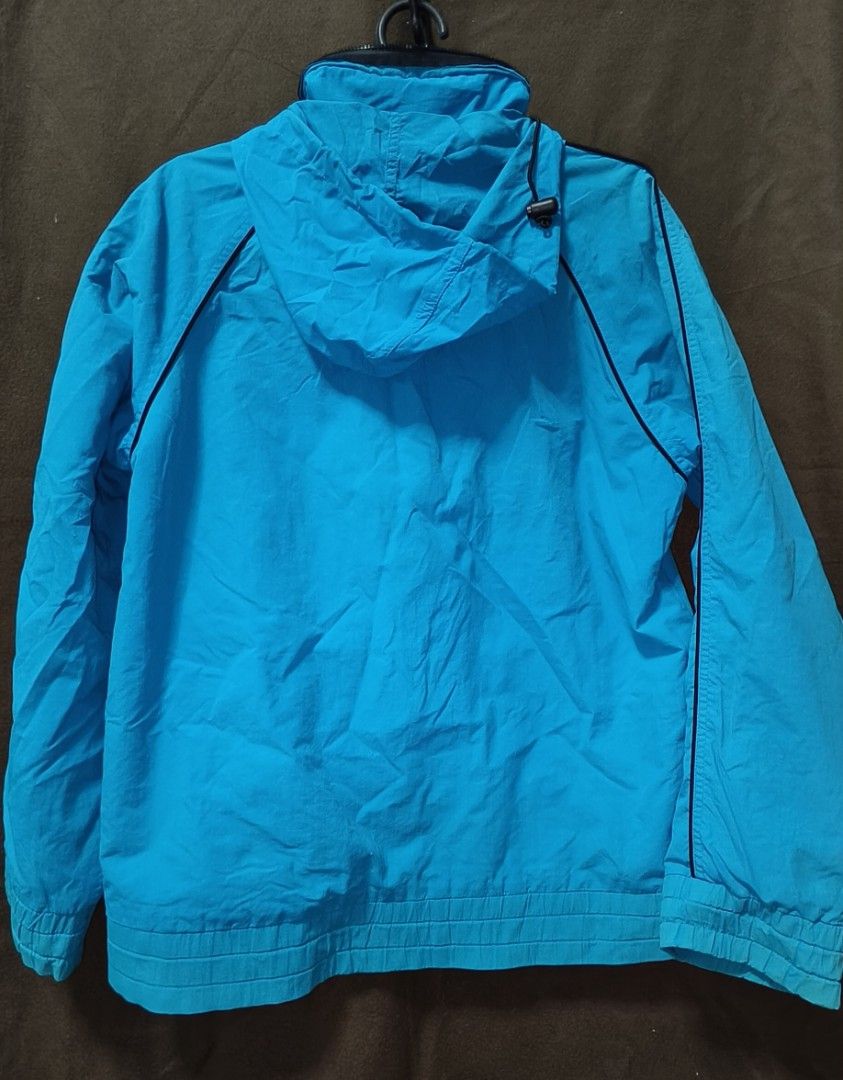 Pre-owned Windbreaker Jacket with Hoodie (Category: Coats, Jackets and Outerwear) located in Antipolo. Submitted by milanbenjohn (Listing ID 1391466602, Image 3). Description: Pre-owned Windbreaker Jacket with Hoodie 👉Material: Polyester 👉With 2 sides pocket 👉In good used condition 👉Size: fit to M-L Exact Dimensions 👇 Length: 25 inches Width: 21 inches Sleeves length: 24 inches.