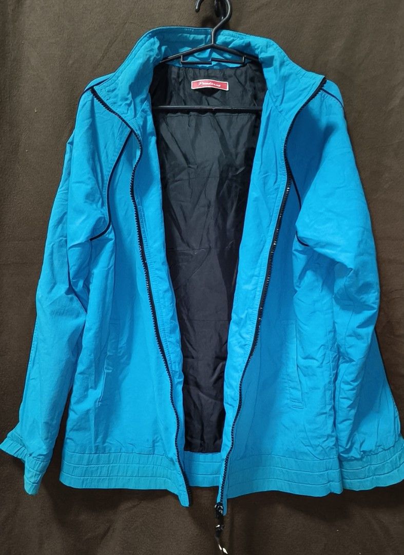 Pre-owned Windbreaker Jacket with Hoodie (Category: Coats, Jackets and Outerwear) located in Antipolo. Submitted by milanbenjohn (Listing ID 1391466602, Image 2). Description: Pre-owned Windbreaker Jacket with Hoodie 👉Material: Polyester 👉With 2 sides pocket 👉In good used condition 👉Size: fit to M-L Exact Dimensions 👇 Length: 25 inches Width: 21 inches Sleeves length: 24 inches.
