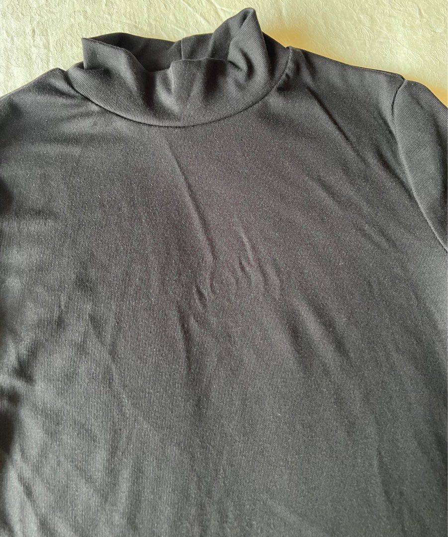 SHEIN Basic Black High Neck Tee (Category: Shirts) located in Petaling Jaya. Submitted by j1apreloved (Listing ID 1391507223, Image 3). Description: - size: M (free size) - material: cotton - colour: black - style: mock neck / short sleeve (turtleneck-inspired) - slim, stretchy & comfy - condition: 9/10 ✅ - like new 👍🏼 - perfect for layering, casual wear, office, or night out and easy to pair with jeans, skirts, or blazers - dm me for more info