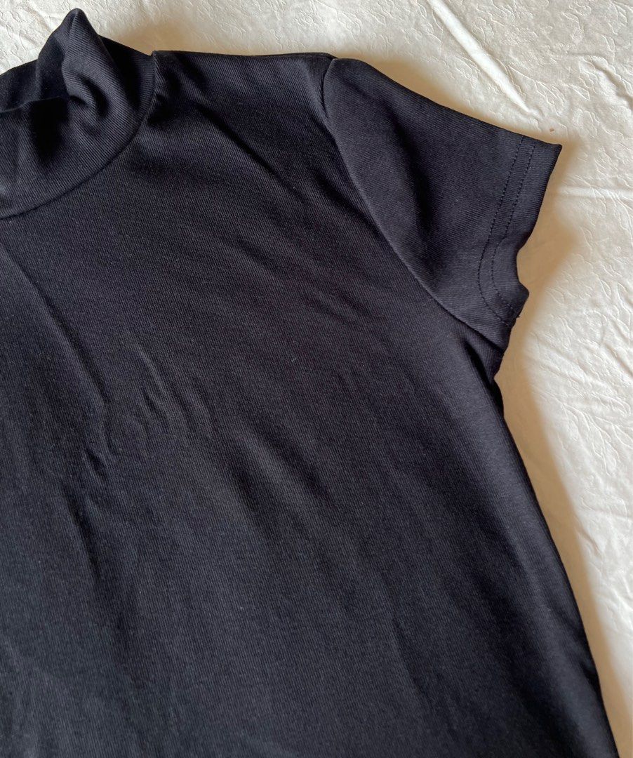 SHEIN Basic Black High Neck Tee (Category: Shirts) located in Petaling Jaya. Submitted by j1apreloved (Listing ID 1391507223, Image 2). Description: - size: M (free size) - material: cotton - colour: black - style: mock neck / short sleeve (turtleneck-inspired) - slim, stretchy & comfy - condition: 9/10 ✅ - like new 👍🏼 - perfect for layering, casual wear, office, or night out and easy to pair with jeans, skirts, or blazers - dm me for more info