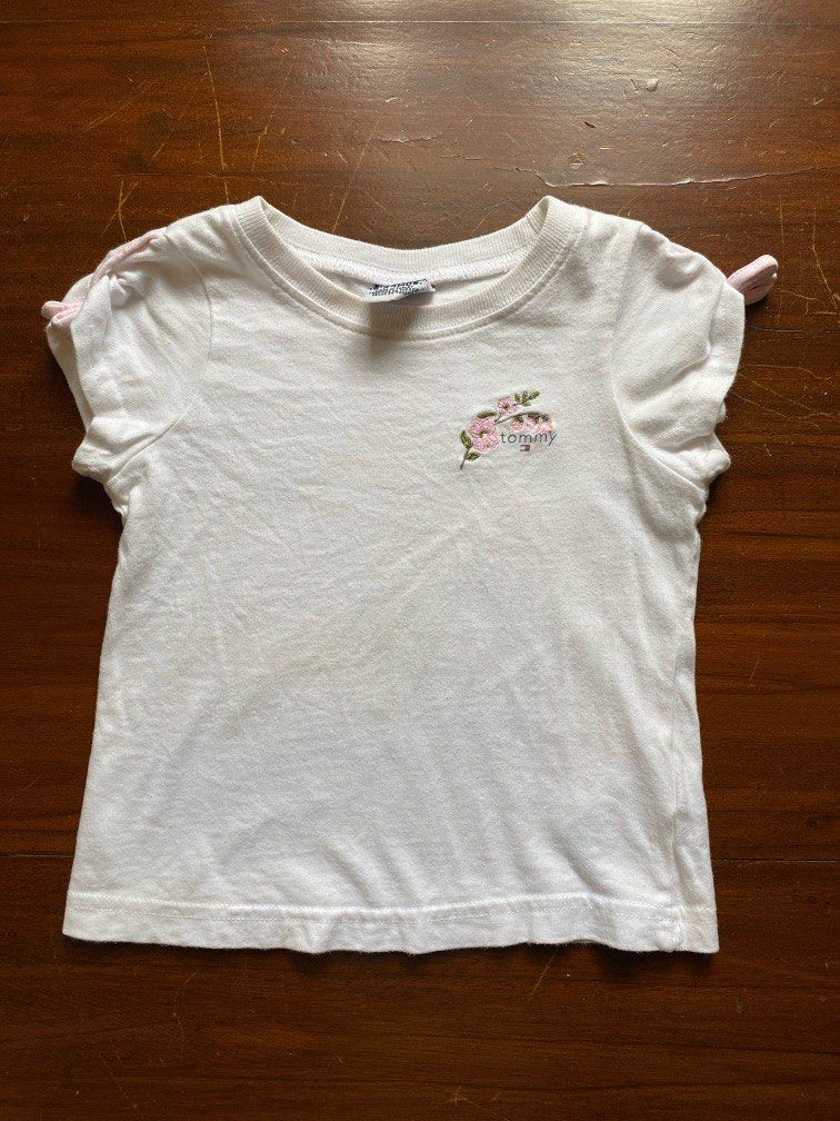 Tommy Hilfiger White Shirt (Category: Babies & Kids Fashion) located in San Mateo. Submitted by ruthb. (Listing ID 1391365953, Image 1). Description: Please see photos for flaws. 18-24 mo on tag Preloved, pls manage your expectations. No orange app checkout..