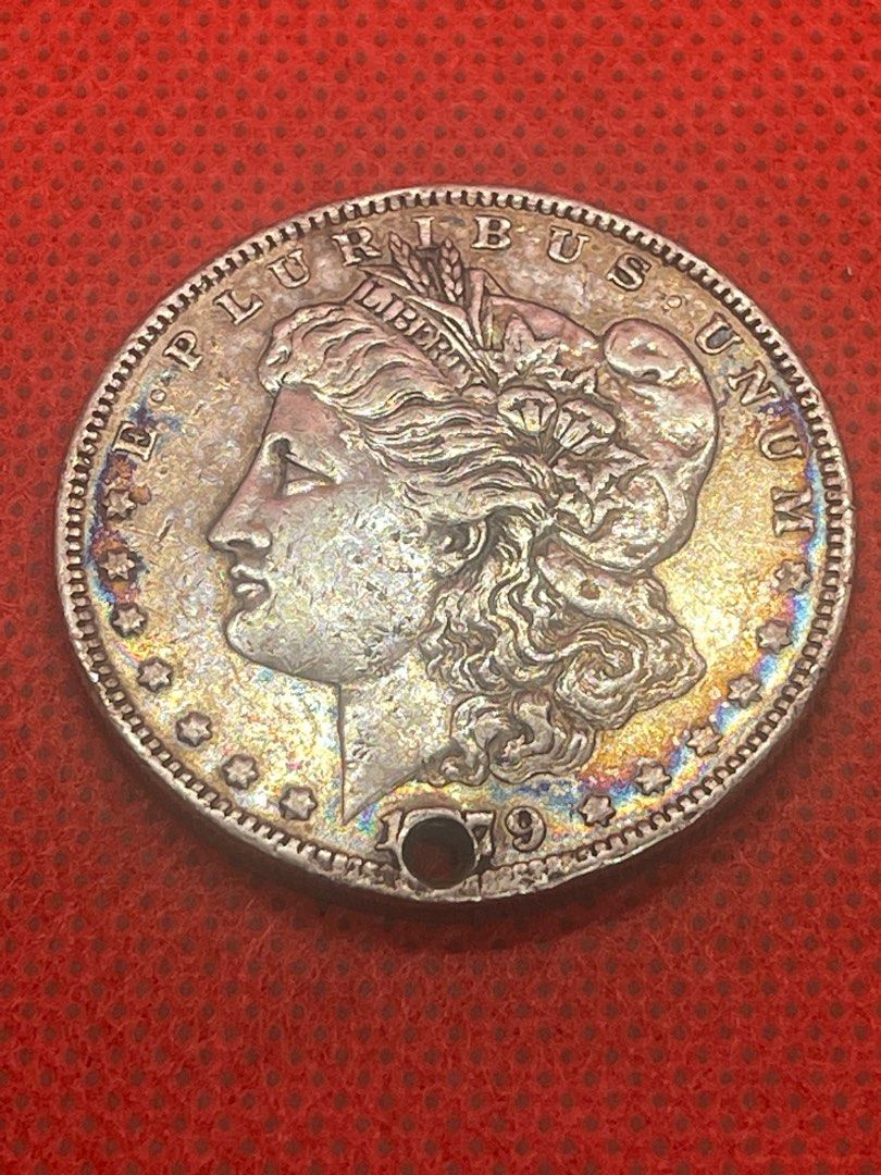 A75 1879o Morgan dollar with a hole silver (Category: Currency) located in Antipolo. Submitted by treasure.keeper (Listing ID 1391623859, Image 1). Description: Toning into rainbow ... fine details .