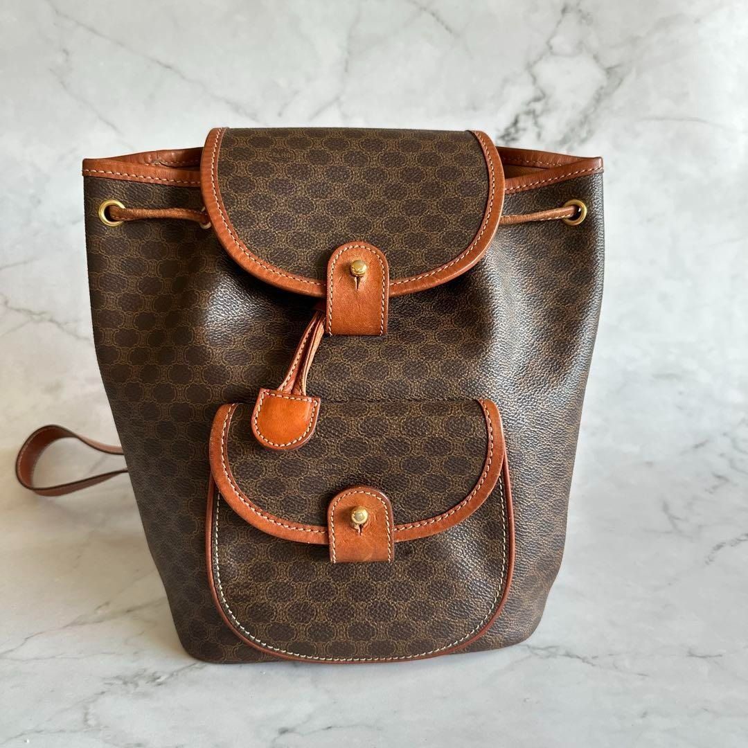 Authentic CELINE Macadam Mini Backpack w/ Certificate of Appraisal (Category: Luxury Bags & Wallets) located in General Trias. Submitted by japan_secondhand_products (Listing ID 1391648960, Image 1). Description: brand CELINE - Color: Brown - Design: Backpack with flap - Number of pockets: 1 outer pocket - Strap: Adjustable shoulder strap Thank you for looking. Please check the photos to see the item. I think it's a beautiful vintage item. The si