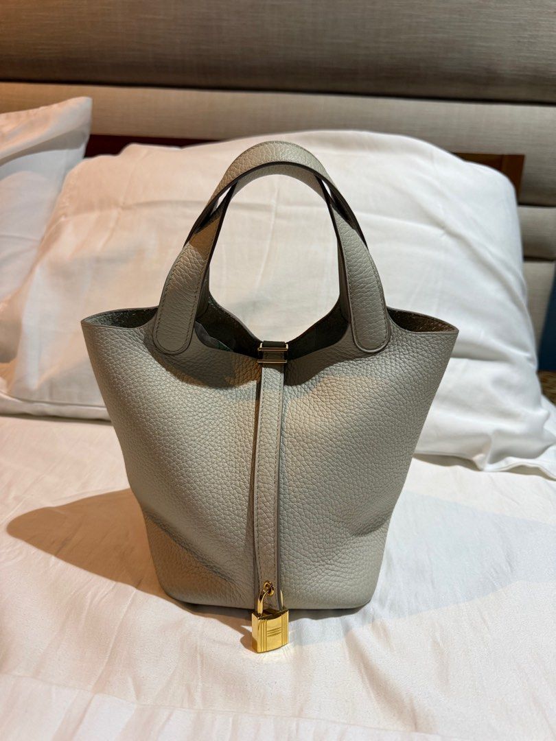 Authentic Hermes Picotin 18 (Category: Luxury Bags & Wallets) located in Bulacan. Submitted by glvzicbg_ (Listing ID 1391599348, Image 1). Description: Authentic Hermes Picotin 18 No flaws - Like new With free generic strap Inclusions: Complete set Rfs: Declutter.