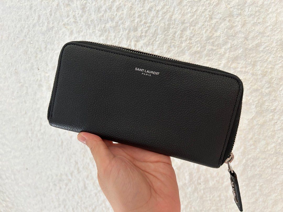AUTHENTIC YSL Zippy Wallet (Category: Luxury Bags & Wallets) located in Paranaque City. Submitted by Re_Up (Listing ID 1391559724, Image 1). Description: Super clean pa but there are minor flaws that is slightly noticeable but may be able to be fixed. Hardware are in very good condition, no foul smell. No other inclusions but can guarantee it’s authentic. Price is firm..