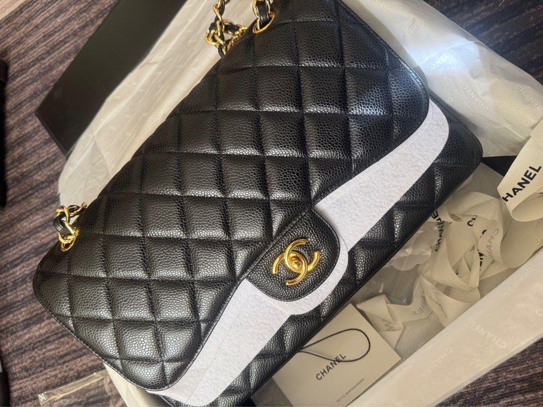 CC Double flap Jumbo Caviar Leather Bag (Category: Shoulder Bags) located in Quezon City. Submitted by celestial_garage_sale (Listing ID 1391554120, Image 2). Description: Please read: Lightly used. Only issue is there a little scratch on the lock hardware but unnoticeable. Hence selling it in a very good price. I only used it a few time when I traveled abroad, then kept it in a box. Jumbo double flap. Gold hardware. Genuine Leather. Caviar leath