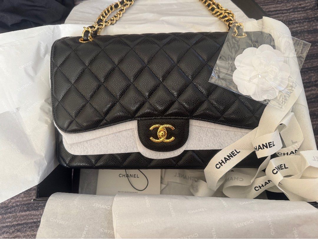 CC Double flap Jumbo Caviar Leather Bag (Category: Shoulder Bags) located in Quezon City. Submitted by celestial_garage_sale (Listing ID 1391554120, Image 3). Description: Please read: Lightly used. Only issue is there a little scratch on the lock hardware but unnoticeable. Hence selling it in a very good price. I only used it a few time when I traveled abroad, then kept it in a box. Jumbo double flap. Gold hardware. Genuine Leather. Caviar leath