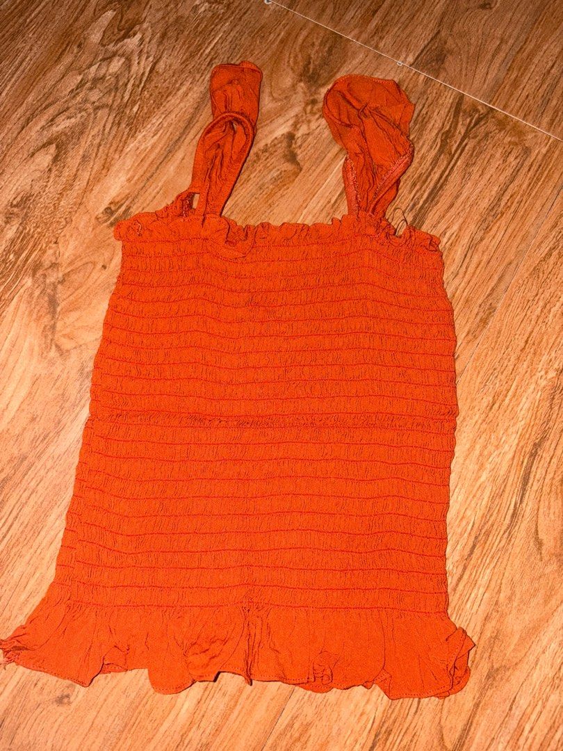 F21 Orange Fitted Top (Category: Sleeveless) located in Rizal. Submitted by cs04_ (Listing ID 1391672625, Image 1). Description: - no flaws at all - can fit xs-s since stretchable pm me for price nego :).