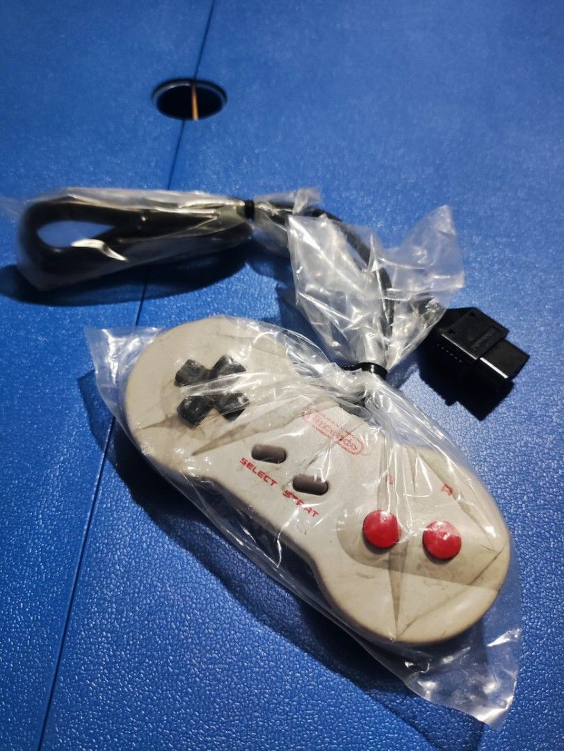 Nintendo Family Computer Dog Bone Controller (Category: Nintendo) located in Baliuag. Submitted by vernede.guzman (Listing ID 1391685156, Image 1). Description: Unused brand new with plastic from Japan..