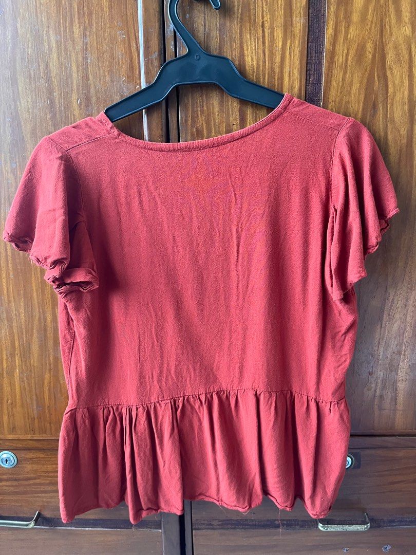Orange blouse (Category: Blouses) located in Manila. Submitted by decluttify (Listing ID 1391663296, Image 2). Description: Red orange basic blouse with plain solid color and design Perfect for any occasion Fits S-M Fashionable Streetwear Casual Office wear.