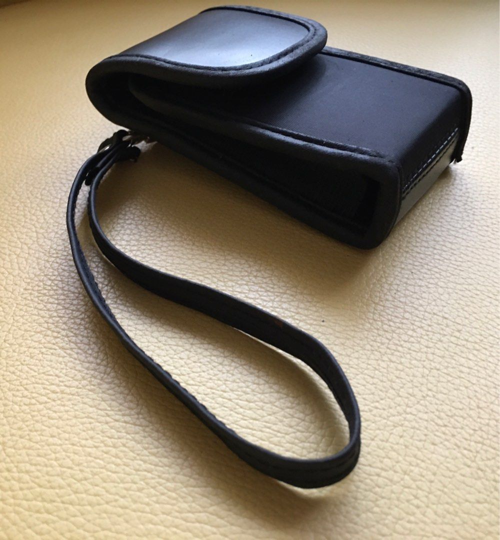 Pocket Digital Camera Leather Case (Category: Camera Bags & Carriers) located in Tarlac. Submitted by greatfindstrlc (Listing ID 1391623886, Image 3). Description: Japan made, black leather carry around case for your old pocket digital camera with wrist strap. Ave Specs. L 10cm W 6.5cm H 3 cm. Digital camera is for presentation only, not included..