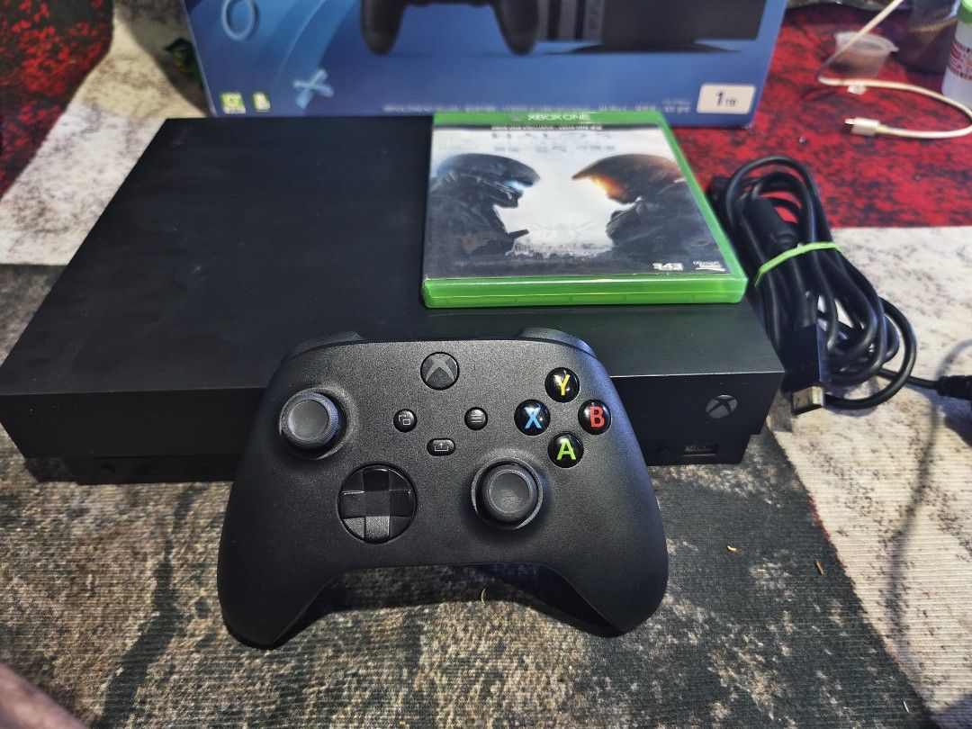Xbox One X (Category: Xbox) located in Binan City. Submitted by olxph_401981327 (Listing ID 1391684025, Image 1). Description: For Sale only! Xbox One X with: 1 Controller with 2 Rechargeable Batteries HDMi PowerCord Halo 5 Game 8500.