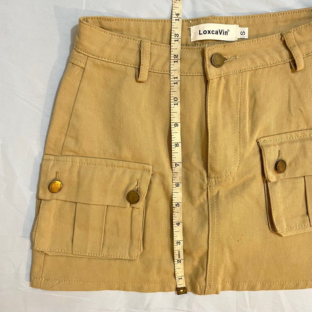 Y2k Khaki Cargo Mini Skirt (Category: Skirts) located in Las Pinas. Submitted by sugardew (Listing ID 1391734928, Image 3). Description: fits xs to s only ~ waist: 25-26in length: 13in (non-stretch fabric) rfs: decluttering loc: alabang mop: gcash, maya shipping: lalamove.
