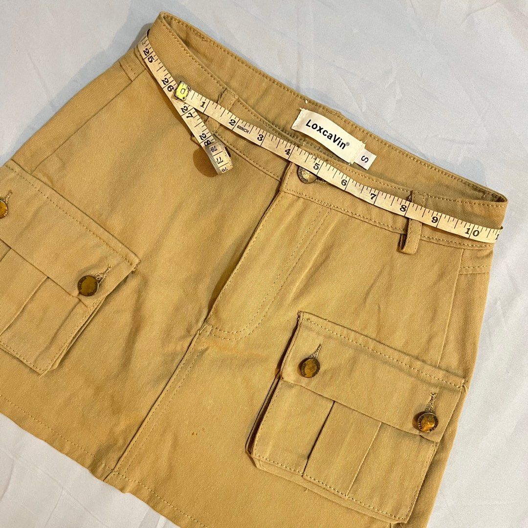 Y2k Khaki Cargo Mini Skirt (Category: Skirts) located in Las Pinas. Submitted by sugardew (Listing ID 1391734928, Image 2). Description: fits xs to s only ~ waist: 25-26in length: 13in (non-stretch fabric) rfs: decluttering loc: alabang mop: gcash, maya shipping: lalamove.