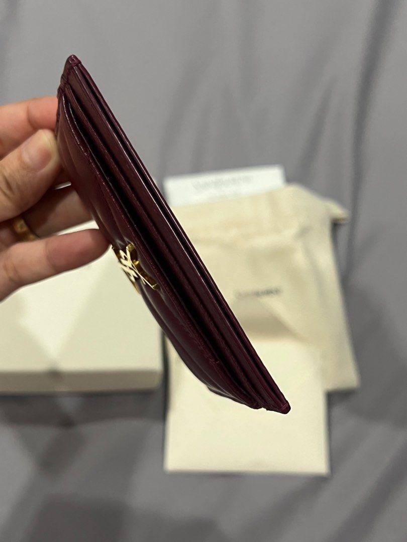 YSL card holder (Category: Luxury Bags & Wallets) located in Cavite. Submitted by joancelestial (Listing ID 1391599182, Image 3). Description: Yves Saint Laurent Card holder Cherry red Used once! Ships from Cavite Bought from Korea. Complete inclusion (box, paperbag, store receipt, dustbag and care card).