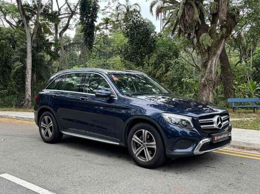 Mercedes-Benz GLC-Class GLC250 4MATIC (A) (Category: Used Cars) located in Singapore. Submitted by carousellcars (Listing ID 1452610424, Image 2). Description: A premium, mid-sized luxury crossover SUV. This specific designation denotes a combination of the vehicle's standard luxury specifications, factory 18-inch alloy wheels (R18), and it's high-performance LED lighting package. Features: 2.0-liter inline-4 turbocharged engine. 155.0 kW/207 bhp