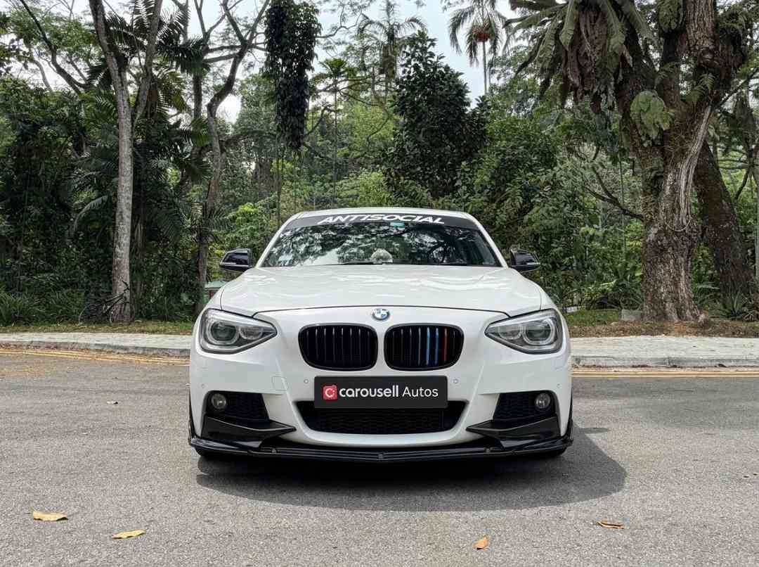 BMW 1 Series Hatchback 118i 5dr (A) (Category: Used Cars) located in Singapore. Submitted by carousellcars (Listing ID 1450396590, Image 1). Description: We pride ourselves on offering some of the most competitive deals in the market, ensuring that you can make informed decisions with complete confidence. Every step of the purchasing process is handled with professionalism and integrity, reflecting our commitment to building long-term trust and l