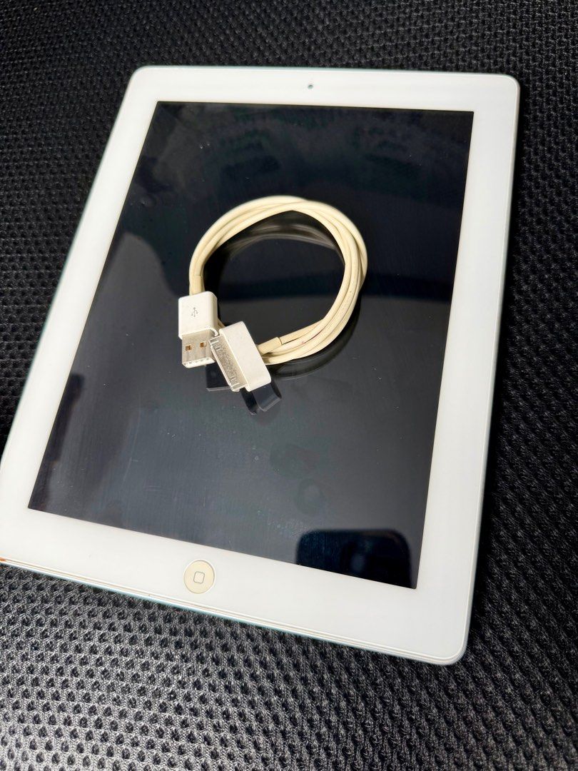 (Category: iPad) located in Singapore. Submitted by loweng (Listing ID 1412880815, Image 1). Description: iPad 2 16GB (Wi-Fi) – Strong battery, no cracks, screen register touch by itself & no sound output. Condition: 1. Battery holds well and lasts long 2. Powers on and charges normally 3. Screen has no cracks, minimal scratches 4. Screen registers touches by itself 5. No sound output 6. Never repaired before Includes: 1. iPad unit 2. Charging ca