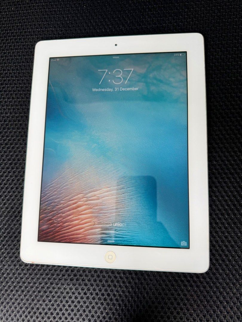 (Category: iPad) located in Singapore. Submitted by loweng (Listing ID 1412880815, Image 2). Description: iPad 2 16GB (Wi-Fi) – Strong battery, no cracks, screen register touch by itself & no sound output. Condition: 1. Battery holds well and lasts long 2. Powers on and charges normally 3. Screen has no cracks, minimal scratches 4. Screen registers touches by itself 5. No sound output 6. Never repaired before Includes: 1. iPad unit 2. Charging ca
