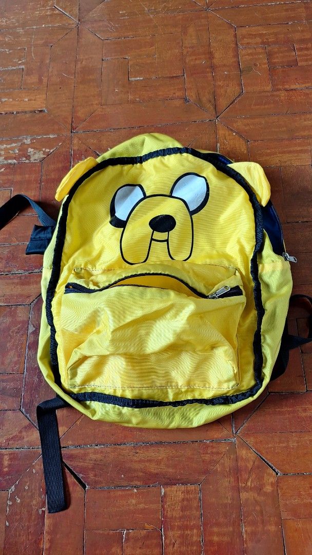 Adventure Time Jake Backpack (Category: Backpacks) located in Marikina City. Submitted by thesecondroomph (Listing ID 1412872773, Image 1). Description: Adventure time convertible backpack, Jake is okay but Finn is showing cracks, namamalat na.
